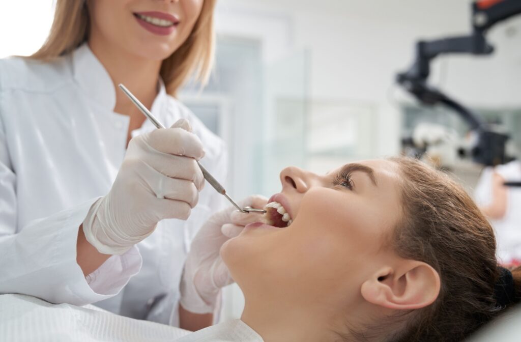 A patient at the dental having their teeth examined.